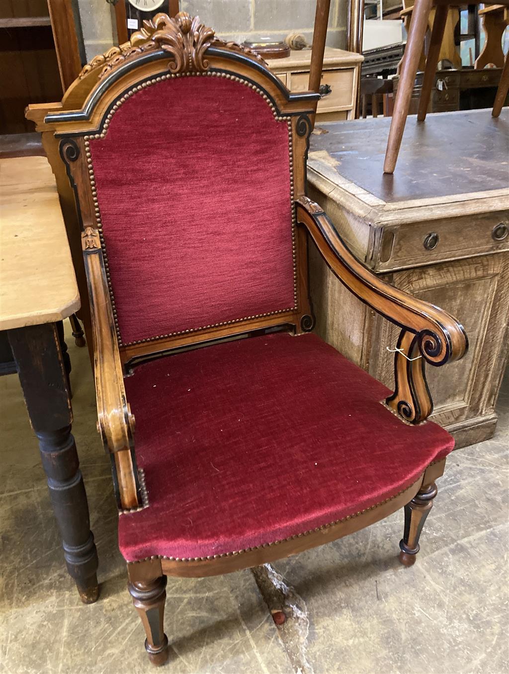 A pair of 19th century Continental carved walnut and ebonised chairs, width 63cm, depth 60cm, height 110cm